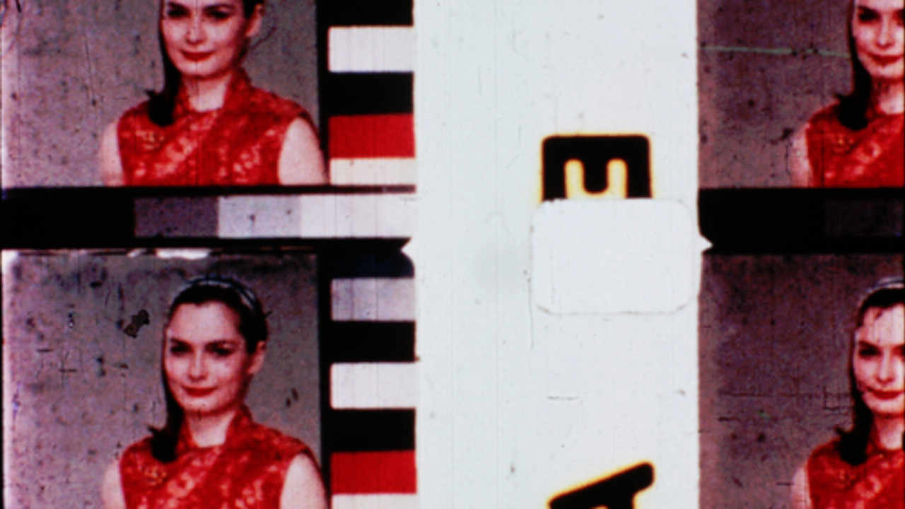 Film in Which There Appear Edge Lettering, Sprocket Holes, Dirt Particles, Etc. Background