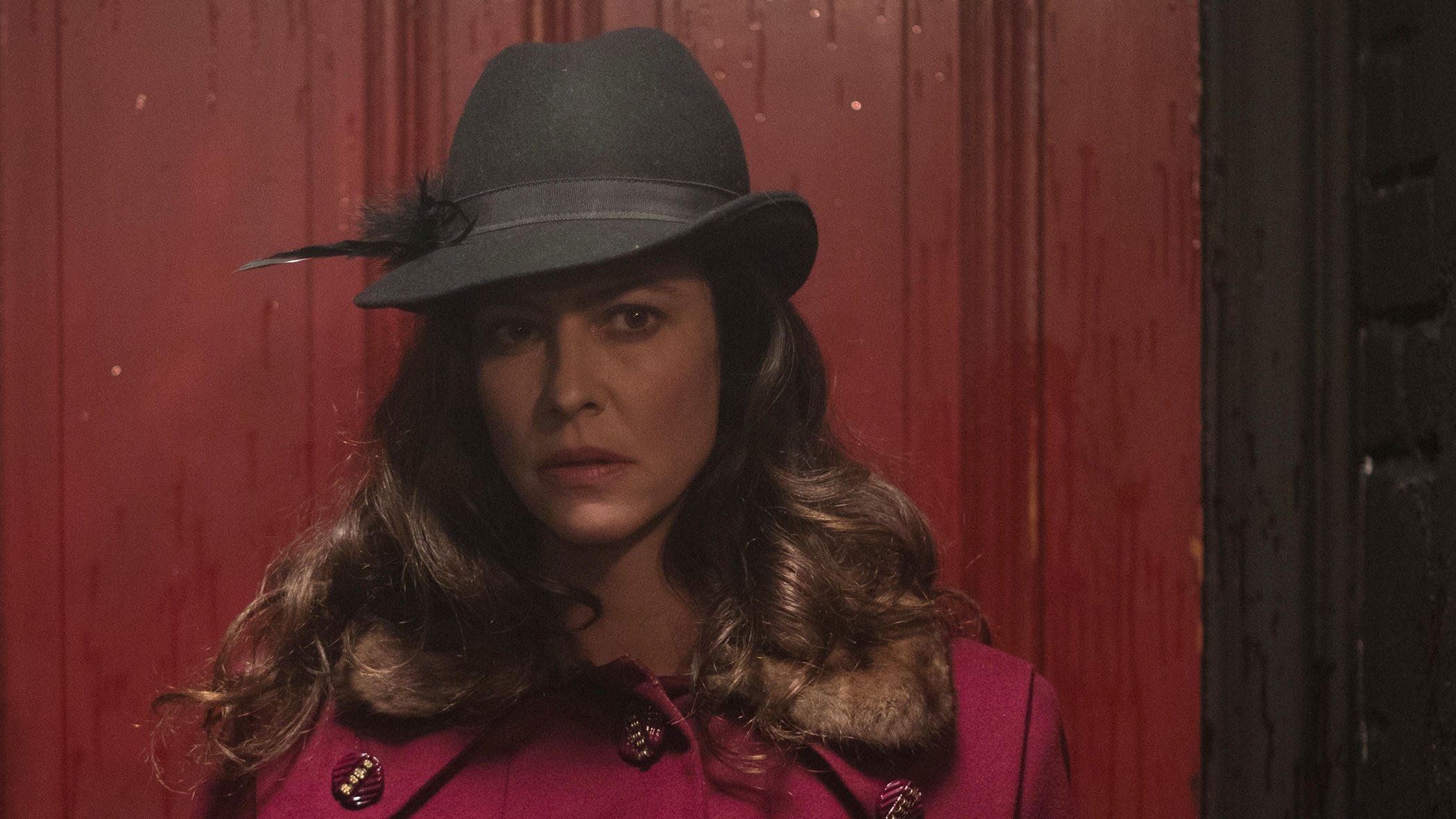 The Most Assassinated Woman in the World Background